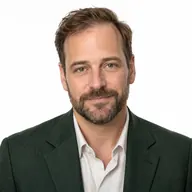 Nathan Ellis desk portrait