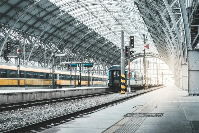 A passenger train at a covered railway station